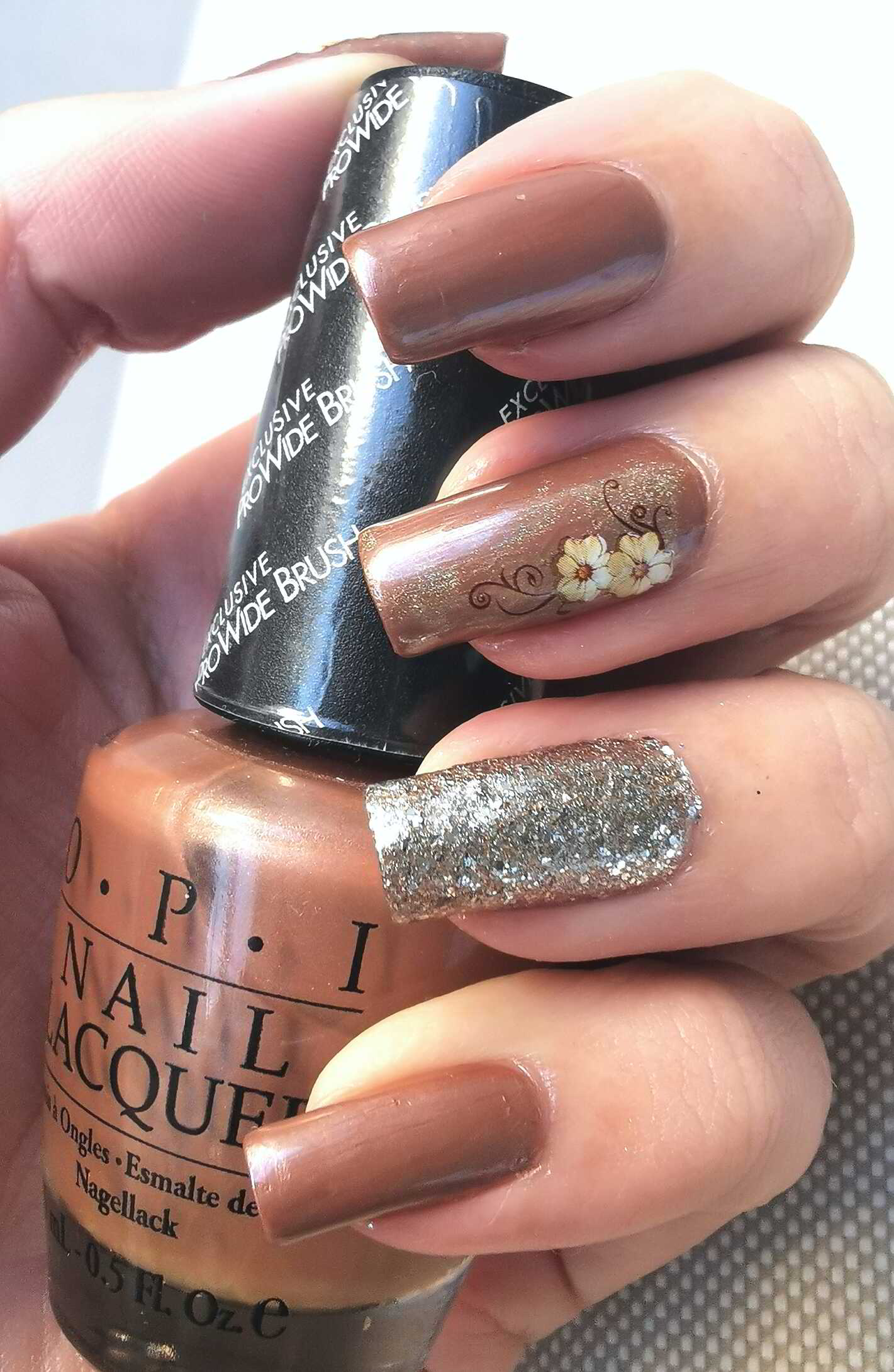 Nail polish manicure of shade NCLA Grace, Color Club Good As Gold,OPI Innsbruck Bronze