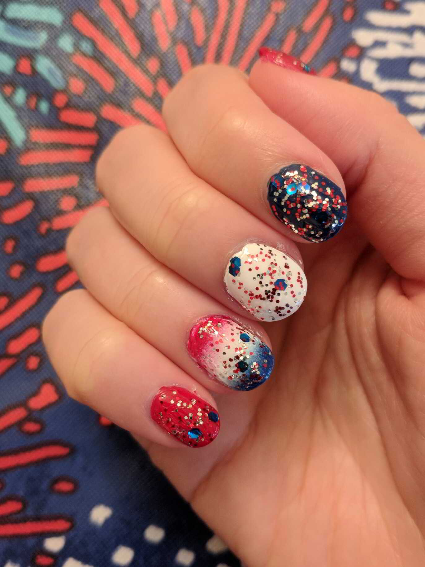 Nail polish manicure of shade OPI Glitter Off, OPI Big Apple Red,Holo Taco Not Milky White,China Glaze Man Hunt,NCLA Born on the Fourth,Jordana Quick Shine Top Coat