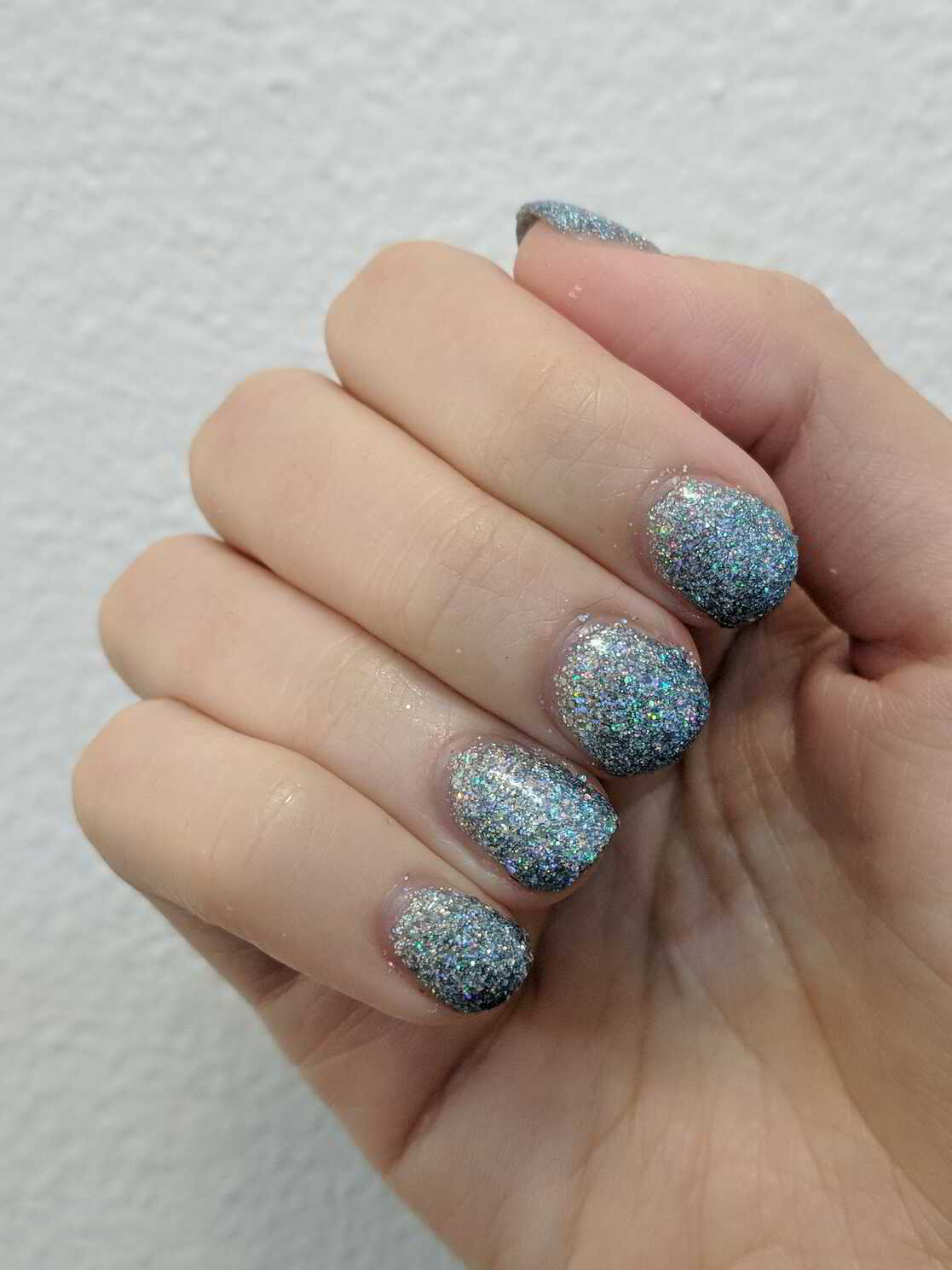 Nail polish manicure of shade OPI Glitter Off, Holo Taco Rainbow Snow,PUEEN Latex Tape,Holo Taco Frost Light,Jordana Quick Shine Top Coat