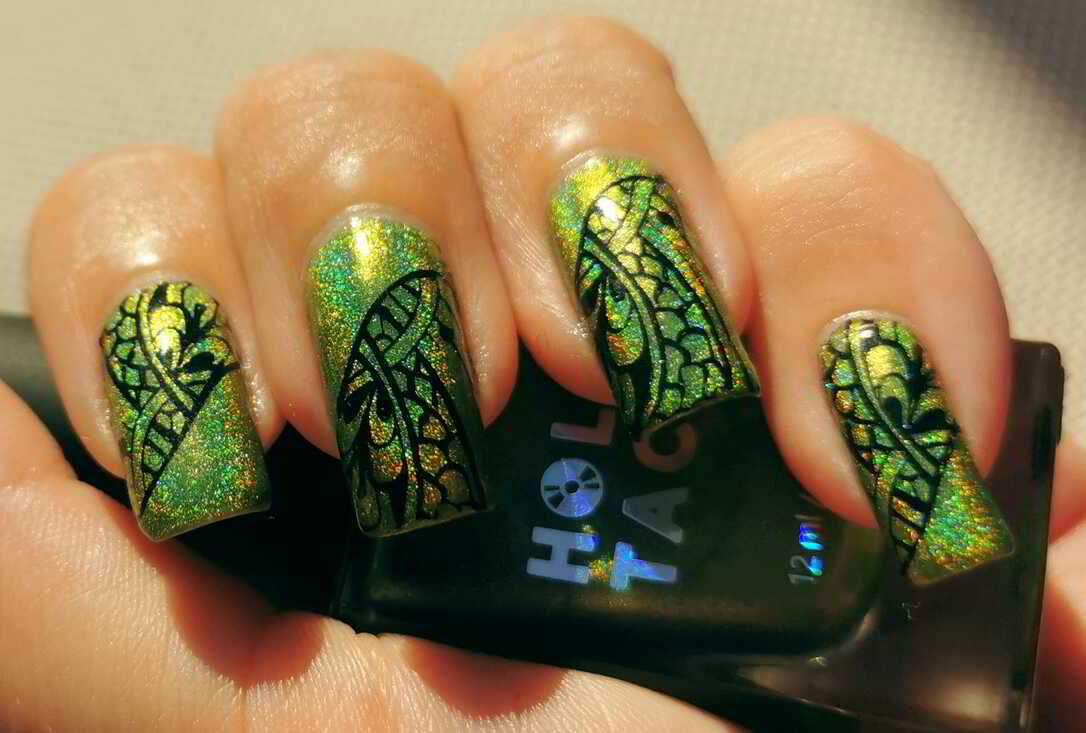 Nail polish manicure of shade Holo Taco Full Charge, Konad Black Stamping Polish