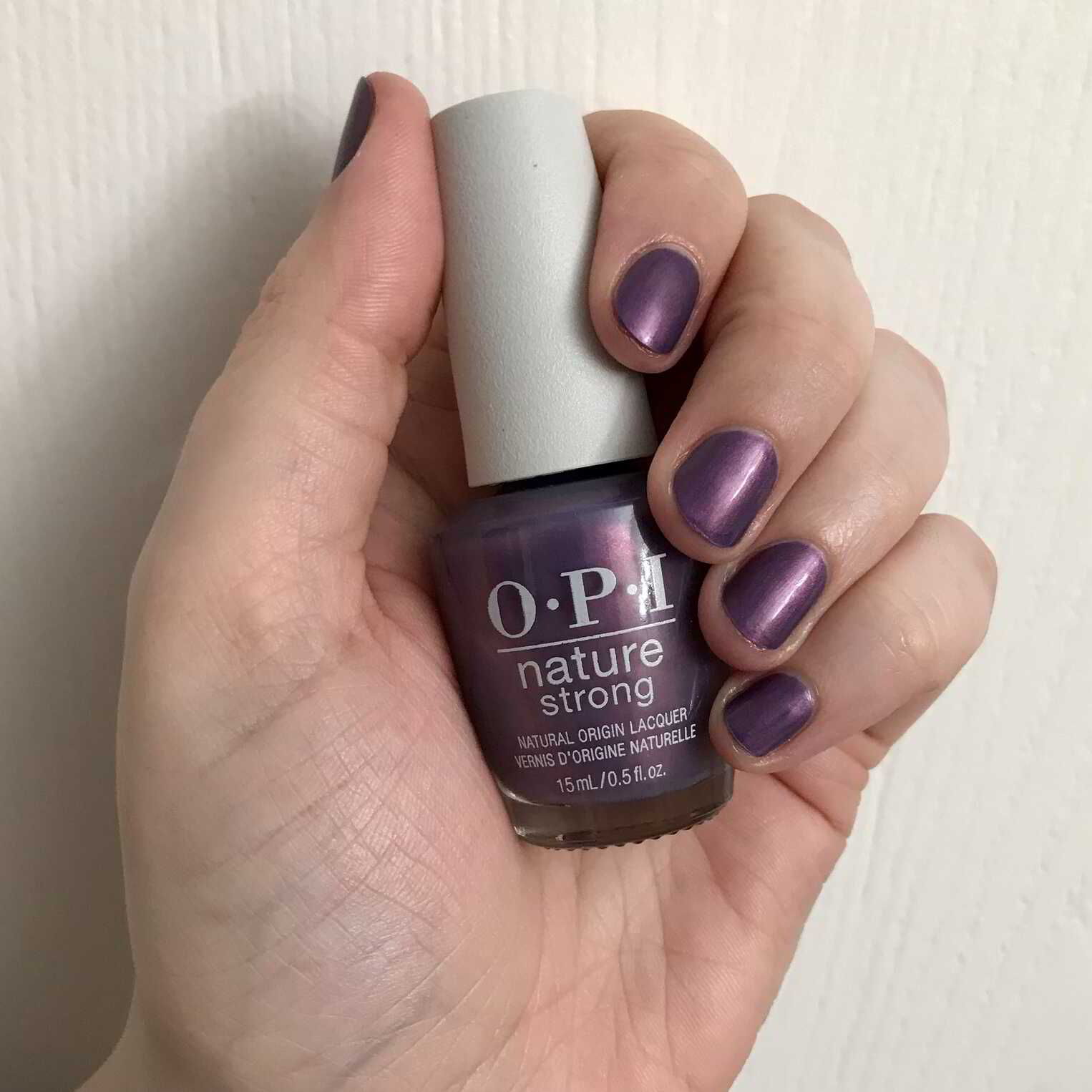 Nail polish manicure of shade OPI NATURE STRONG Achieve Grapeness, 