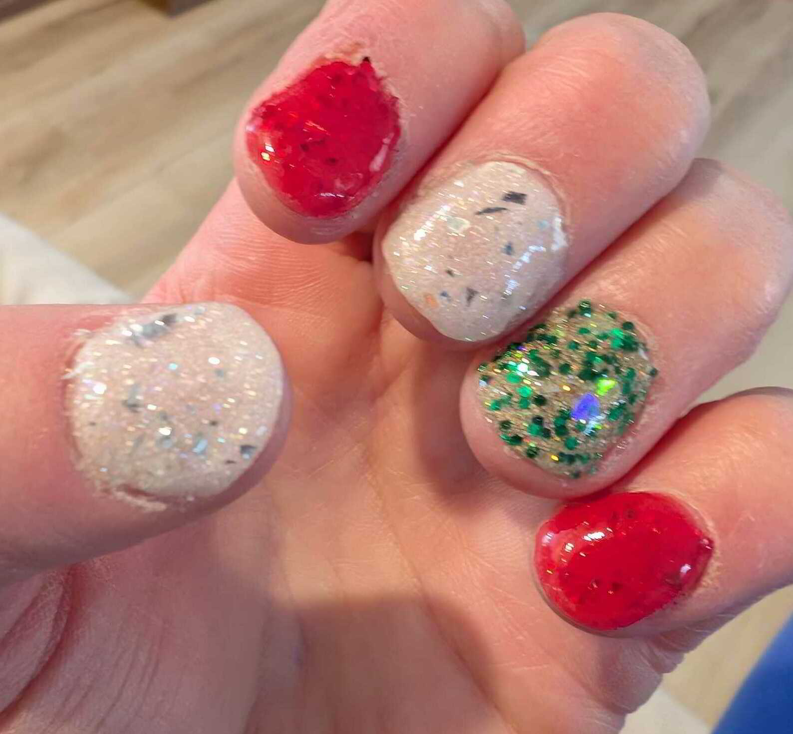 Nail polish manicure of shade Revel Snowglimmer, Revel Golden Evergreen, Revel Cherry Cheer, Revel Vivien, 