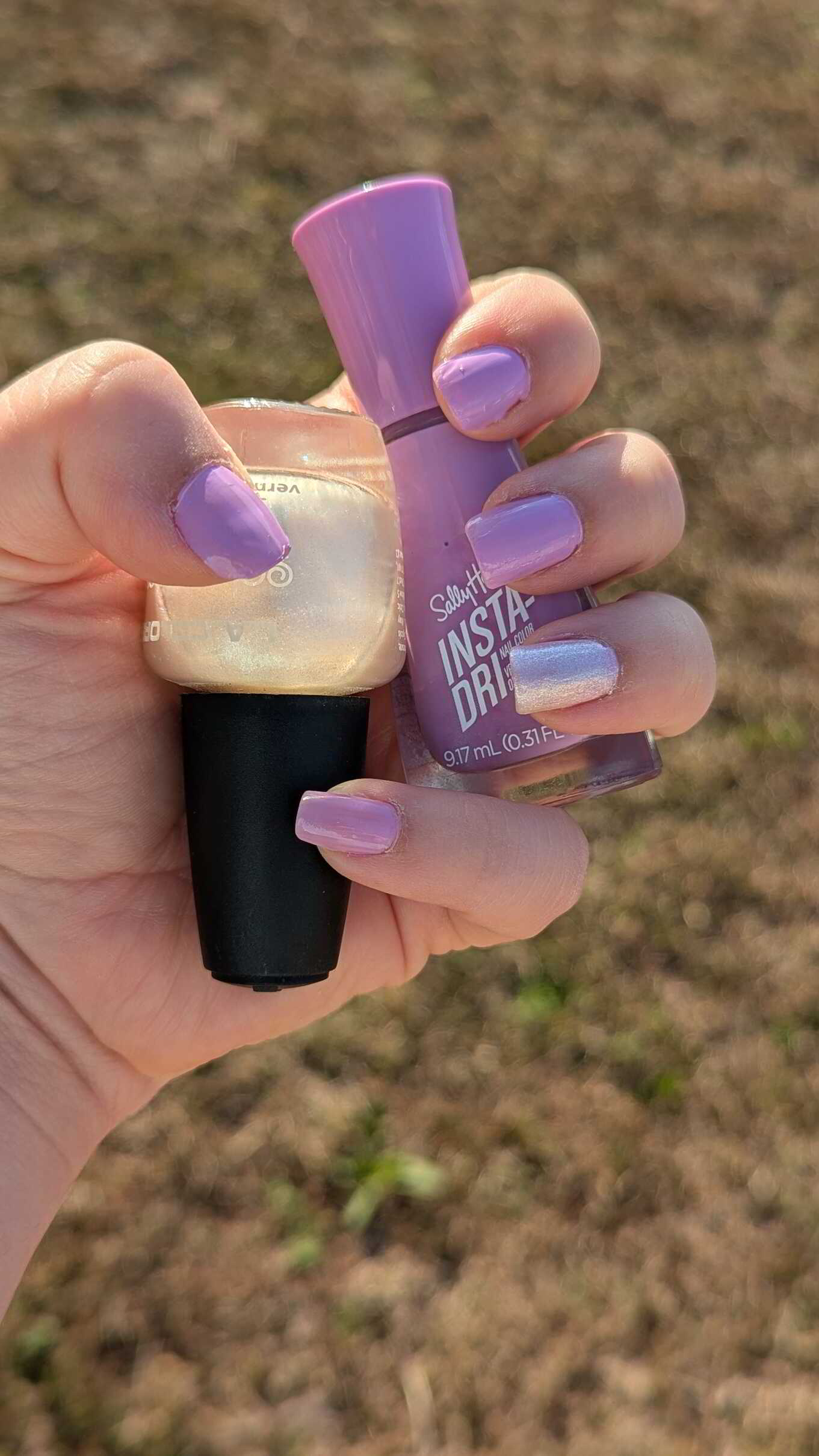 Nail polish manicure of shade Sally Hansen Traveling Light, L.A. Colors Oyster, 