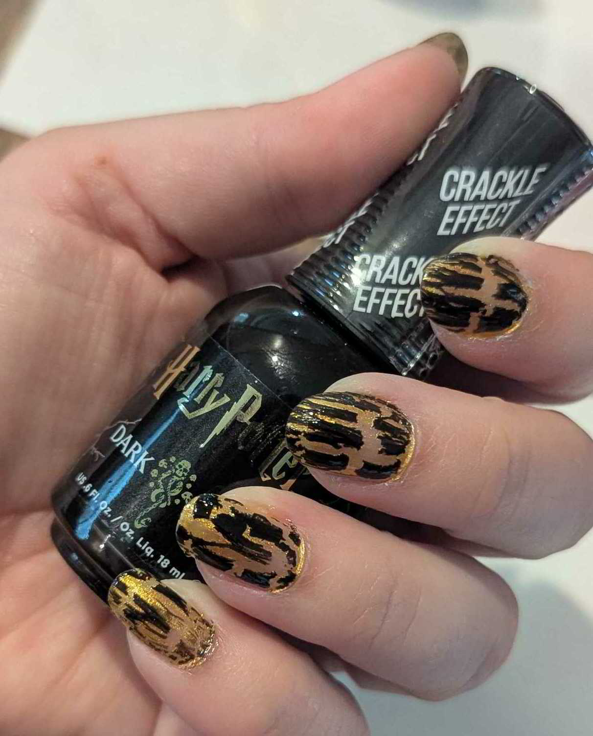 Nail polish manicure of shade Orly Dark Arts, Nailtopia Scar, OPI Top Coat, 