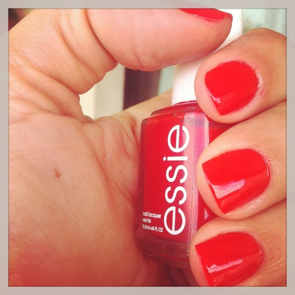 Nail polish swatch / manicure of shade essie Hot Tomato