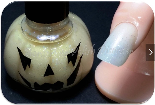 Nail polish swatch / manicure of shade Blue Cross Pumpkin Glow-in-the-Dark