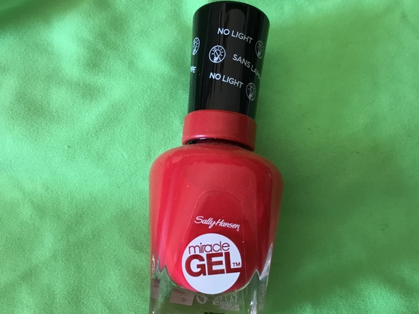 Nail polish swatch / manicure of shade Sally Hansen Red Eye