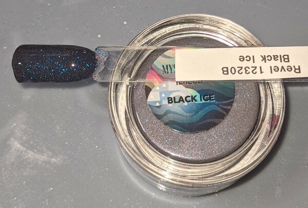 Nail polish swatch / manicure of shade Revel Black Ice