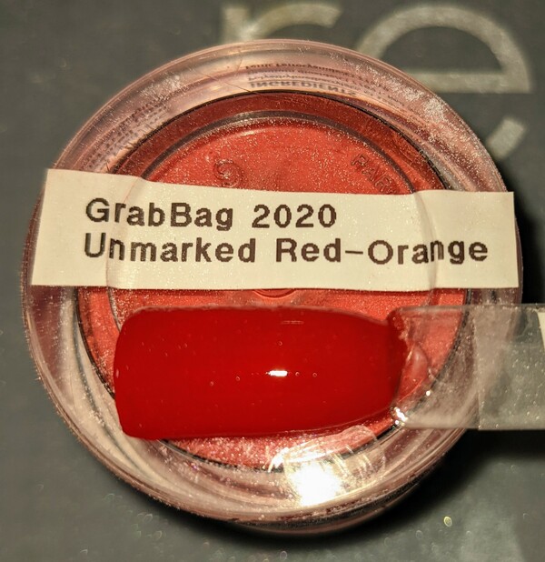 Nail polish swatch / manicure of shade Revel Unmarked Red-Orange