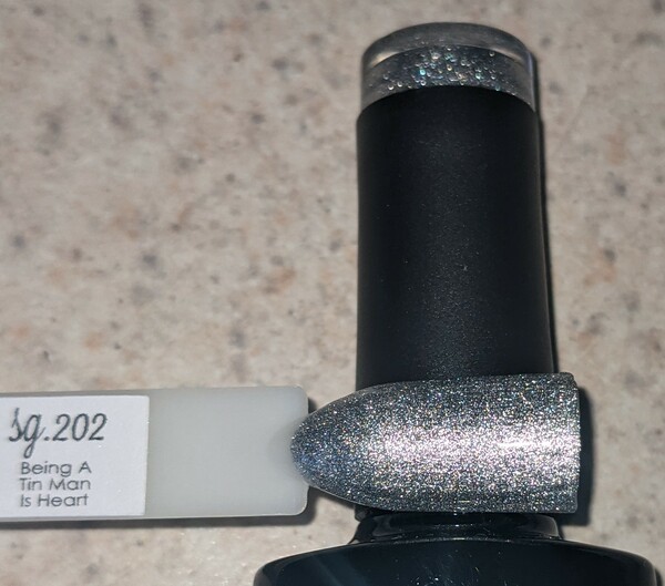 Nail polish swatch / manicure of shade Sparkle and Co. Being A Tin Man Is Heart