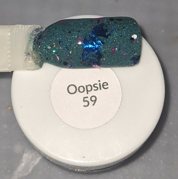 Nail polish swatch / manicure of shade Sparkle and Co. Oopsie 59