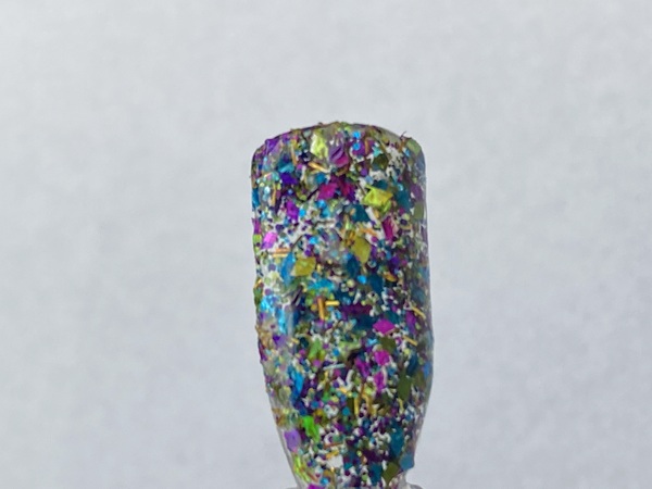Nail polish swatch / manicure of shade Sparkle and Co. Party Gras