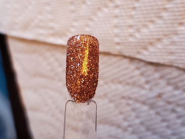 Nail polish swatch / manicure of shade Aikker Shimmer Gold