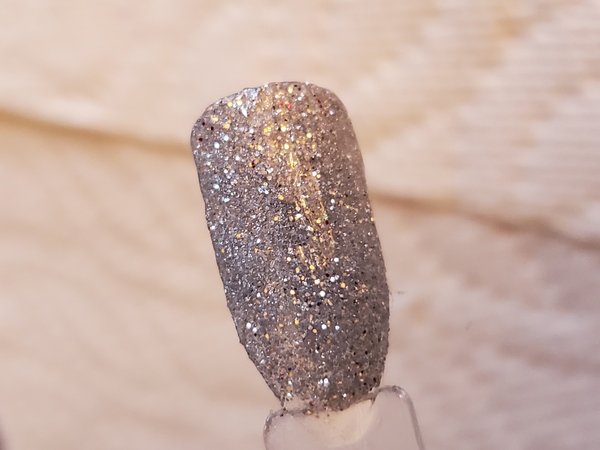 Nail polish swatch / manicure of shade Aikker Shimmer Silver