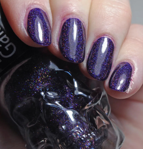Nail polish swatch / manicure of shade Blackheart Dark Purple Galaxy