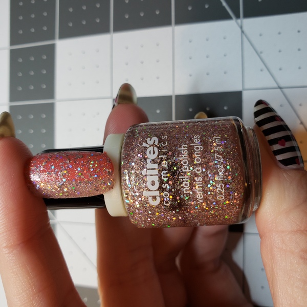 Nail polish swatch / manicure of shade Claire's Pink Glitter