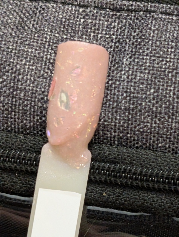 Nail polish swatch / manicure of shade Revel Mother of Pearl