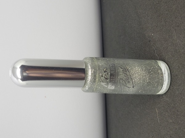 Nail polish swatch / manicure of shade Kiss Silver Glitter