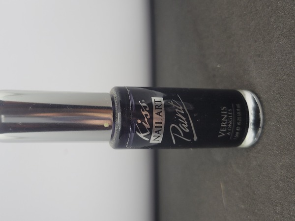 Nail polish swatch / manicure of shade Kiss Black