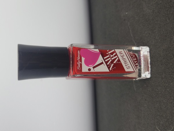 Nail polish swatch / manicure of shade Sally Hansen Red