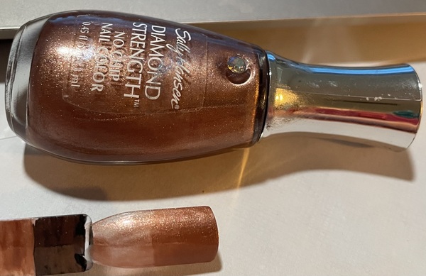 Nail polish swatch / manicure of shade Sally Hansen Antique Bronze
