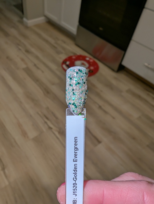 Nail polish swatch / manicure of shade Revel Golden Evergreen