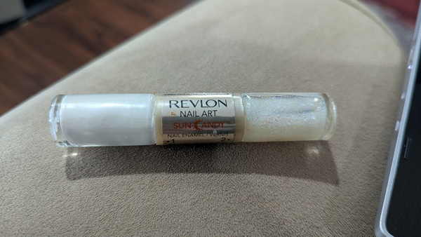 Nail polish swatch / manicure of shade Revlon White Hot