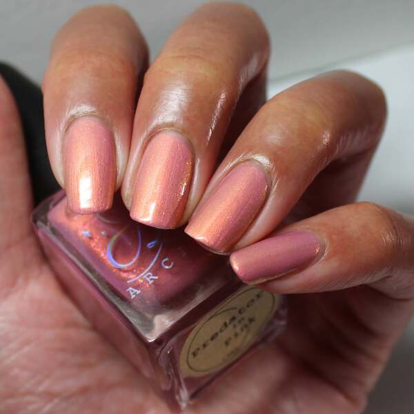 Nail polish swatch / manicure of shade Arcana Lacquer Predator in Pink