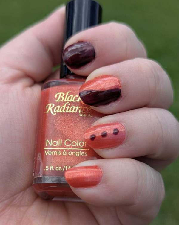 Nail polish swatch / manicure of shade Black Radiance Sparkling Orange