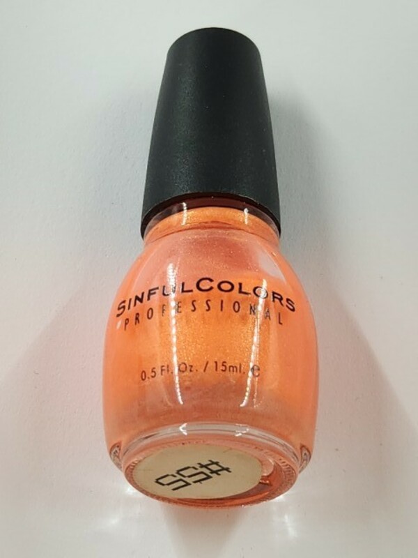 Nail polish swatch / manicure of shade Sinful Colors Neon Red