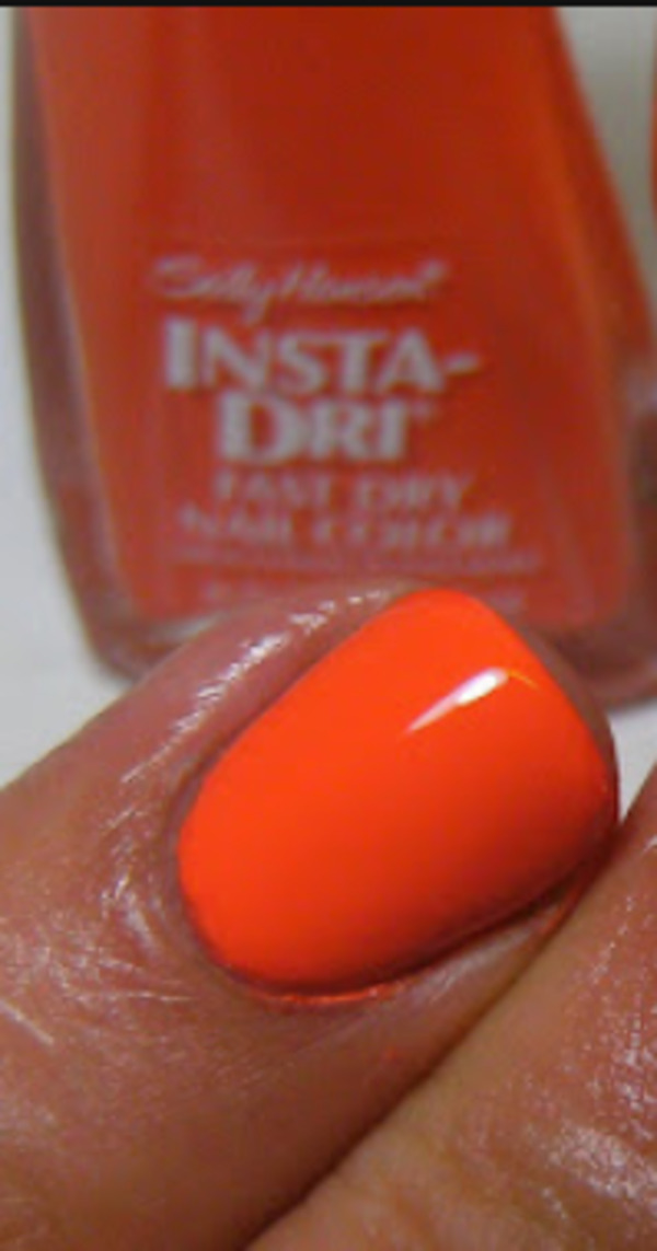 Nail polish swatch / manicure of shade Sally Hansen Orange Impulse