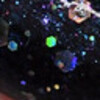 Nail polish swatch of shade Emerald and Ash Helix Nebula