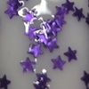 Nail polish swatch of shade Fancy Gloss Purple Mini Stars