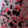 Nail polish swatch of shade Blackheart Black Base Red Splatter