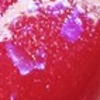 Nail polish swatch of shade Sassy Sauce Polish Electric Lava With Glitter Veins
